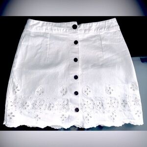Eyelet embroidered white mini skirt